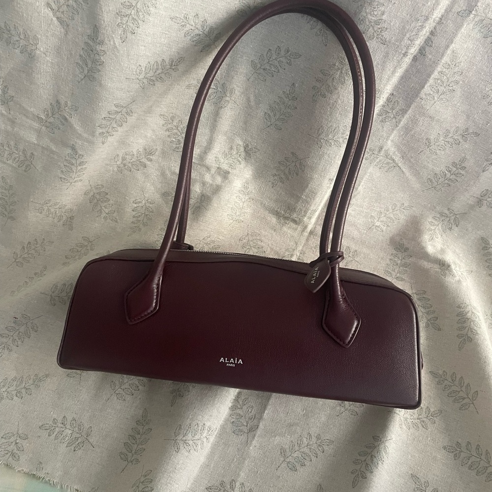 Alaia burgundy leather shoulder baguette bag
